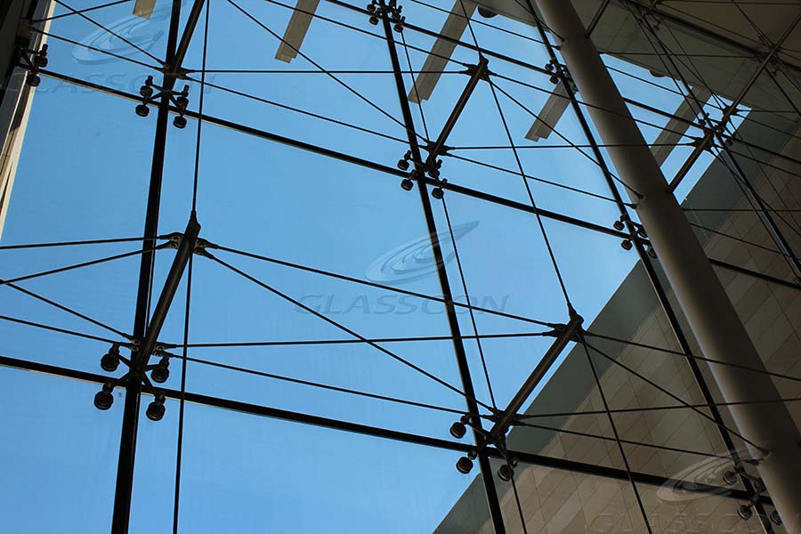 A close up of a glass and steel structure